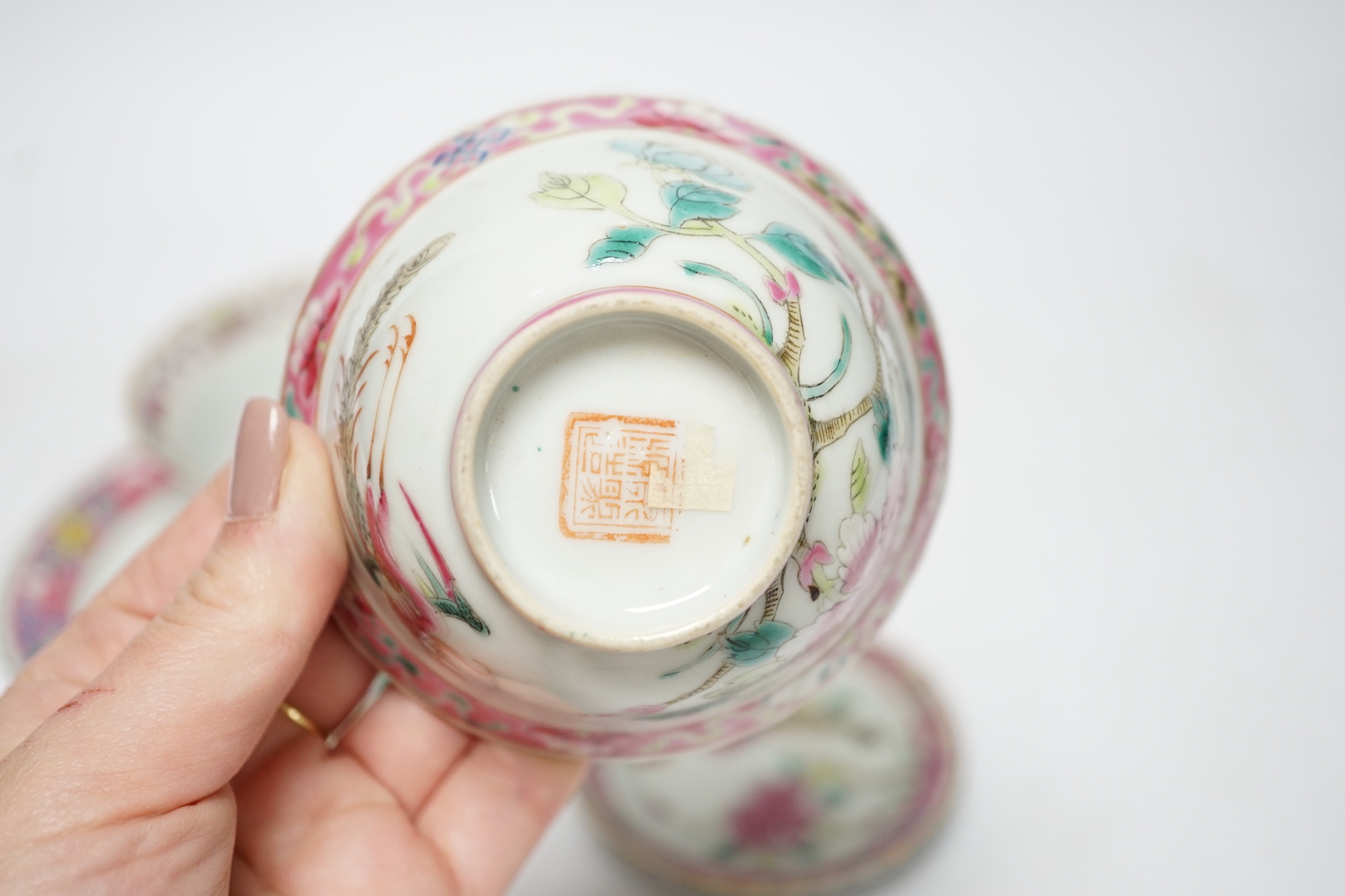 Two Chinese Straits Nonya ware famille rose tea bowls, larger 11cm diameter, and two saucer dishes, Guangxu period